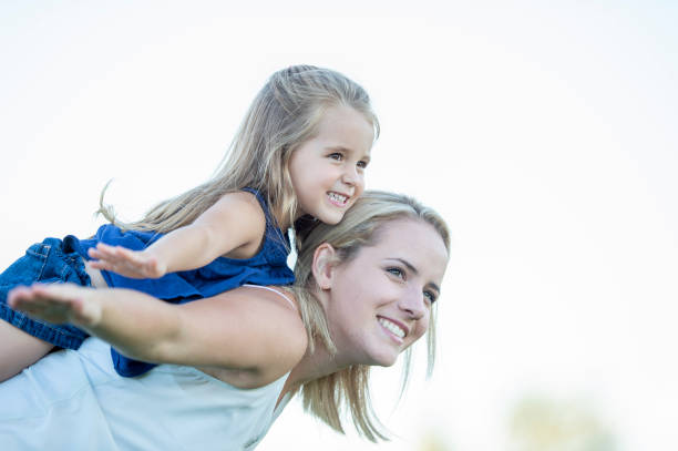 istock Mother and daughter outside 1263245760