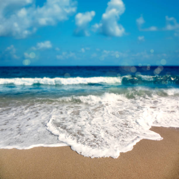 Seascape view with waves and sandy beach in windy day in Deerfield Beach, Florida