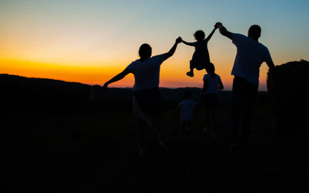 istock Happy farmer family and sunset 1263250203