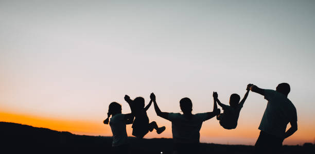 istock Happy farmer family and sunset 1263250352