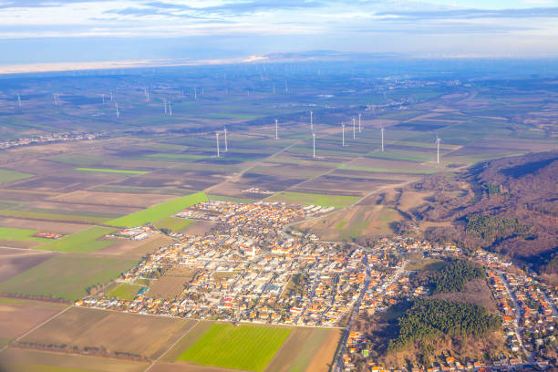 Sommerein town in Austria aerial view . District of Bruck an der Leitha in Lower Austria . View of Vienna suburb with windmills farm