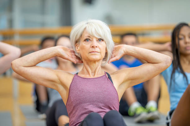 istock Senior woman does a sit-up 1263254200