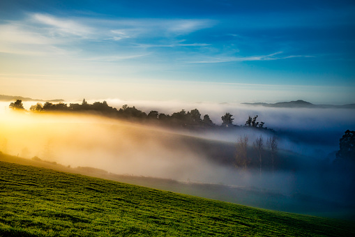 Exploring the Rural Hills of Berwick (south west of Dunedin) at sunrise on a freezing frosty day with low mist and fog rolling through the valleys