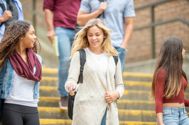 istock Group of university students outside on campus 1263256371