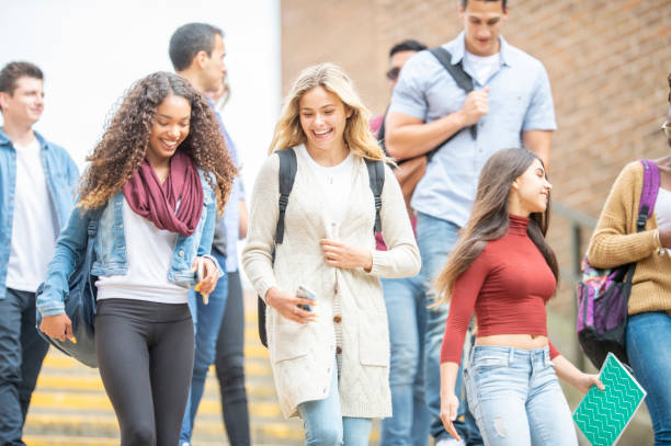 istock Group of university students outside on campus 1263256375