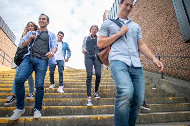 istock Group of university students outside on campus 1263256385