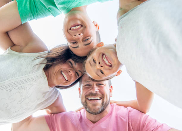 istock Happy family outside together 1263257911