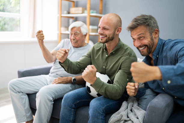 istock Three Generation Sport Fans Watching Football 1263279623