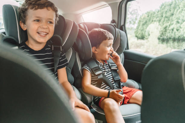 istock Happy playful kids travelling by car 1263279921