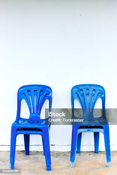 Old And Dirty Blue Plastic Chairs Stock Photo - Download Image Now - Blue, Chair, Decoration