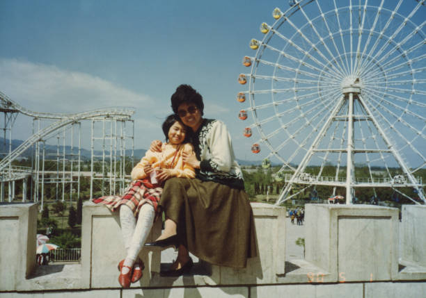 1990s China Mom and daughter photos of real life 1990s China Mom and daughter photos of real life amusement park photos stock pictures, royalty-free photos & images