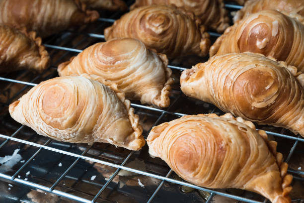 istock Curry puff. Close up the curry puff stack on the strainer after fried. Asian food cuisine. 1263297322