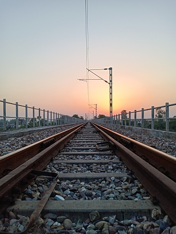 Railroad railway track picture taken at sunset.