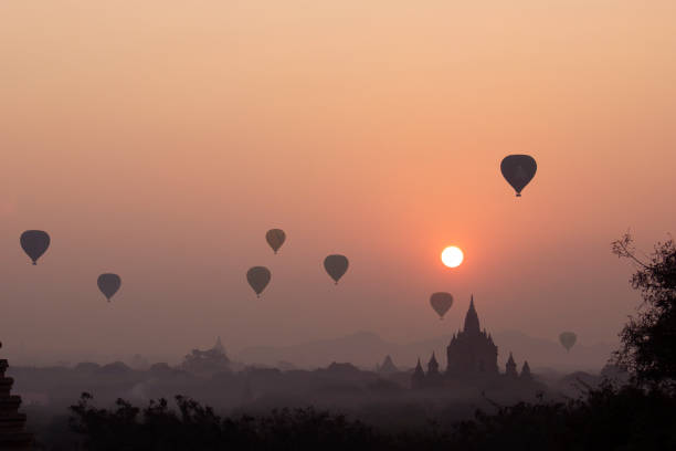 istock Sunrise with hot air balloons 1263302289