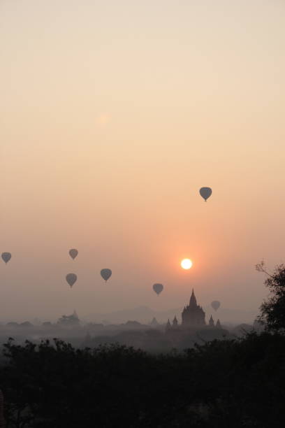 istock Sunrise with hot air balloons 1263302306