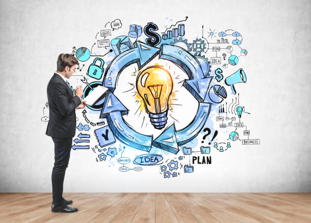 istock Man with clipboard and his business idea 1263312123