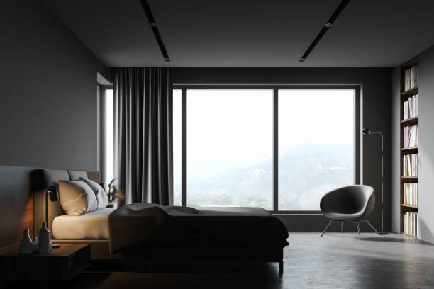 istock Grey bedroom with bookcase and armchair 1263312638