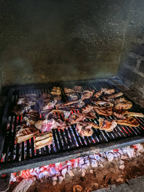 istock Grilled lamb ribs. Large metal grate with hot coals. 1263324208