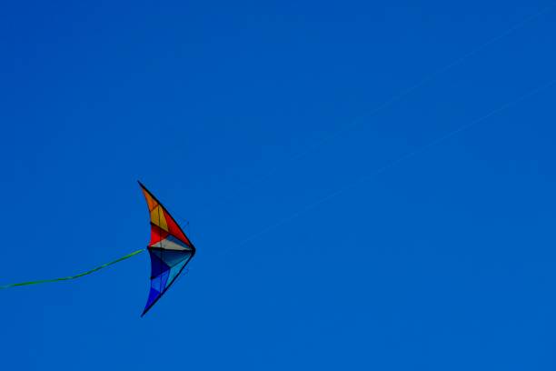 istock A kite flying high against a perfect blue sky 1263325271