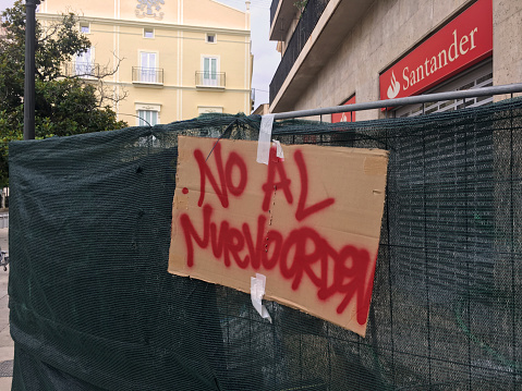 Valencia, Spain - July 12, 2020: Cardboard hanging with the text 'No to the new order'. Many people things that after the coronavirus pandemic things are not going to be the way they used to in a lot of ways