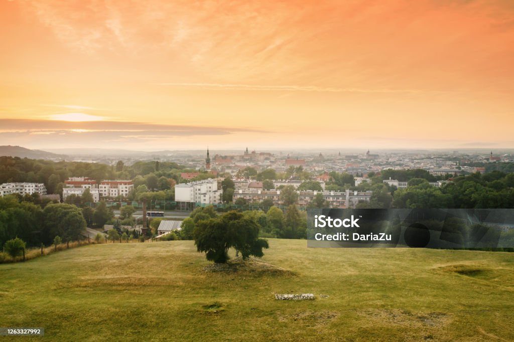 View on Krakow city landscape at the sunset from the Krakus (Krak) Mound in Poland View on Krakow city landscape at the sunset from the Krakus (Krak) Mound in Poland. Tumulus, mythical resting place of Krakow's mythical founder, the legendary King Krakus. Krakow Stock Photo