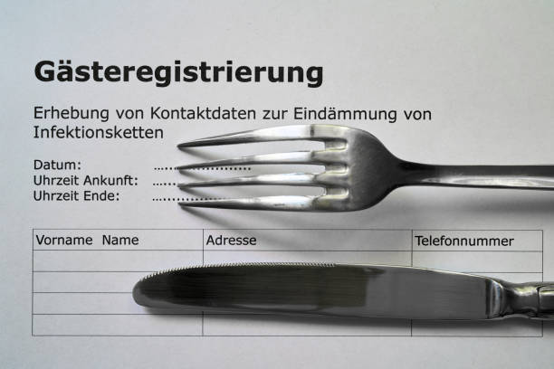 guest registration in a restaurant in Germany Form for guest registration (Gästeregistrierung) in a restaurant in Germany during the Corona pandemic guest book photos stock pictures, royalty-free photos & images