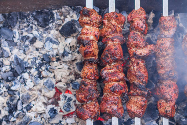 istock Meat on skewers is cooked on hot coals 1263338261