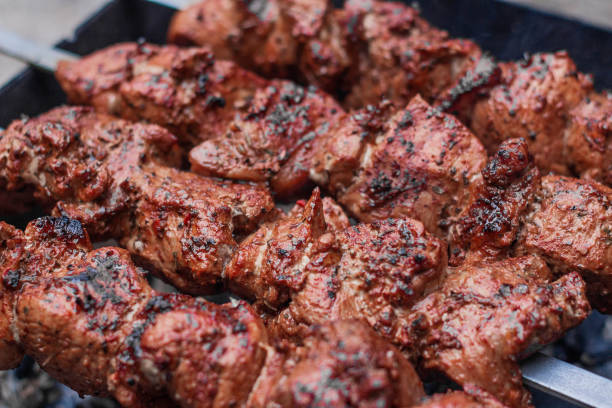 istock Meat on skewers is cooked on hot coals 1263338282