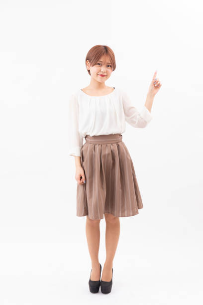 a woman pointing in a white background