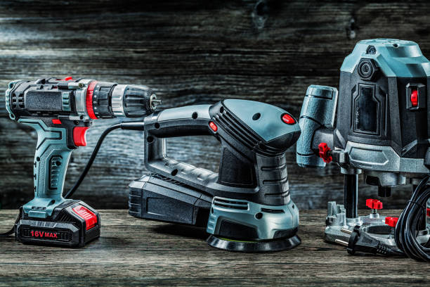 istock electric hand tools orbit wood sander plunge router milling machine and cordless drill driver on vintage wood 1263338750