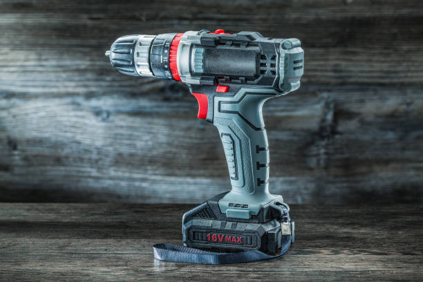 istock electric tools cordless hand drill on vintage wooden background 1263338814