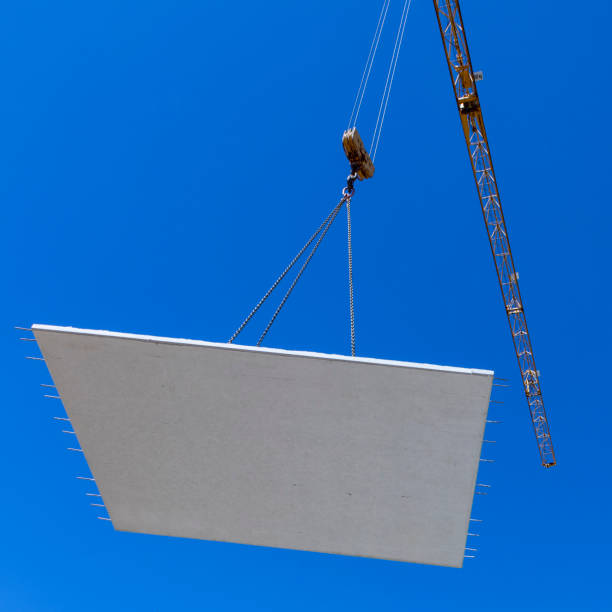 istock waterproof cocrete wall on a hook of a crane at the construction site 1263340371