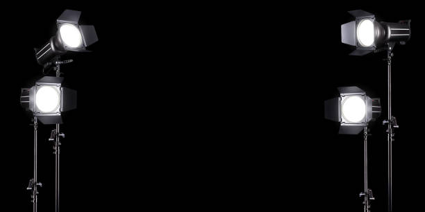 istock Photography studio flash on a lighting stand isolated on black background. 1263341659