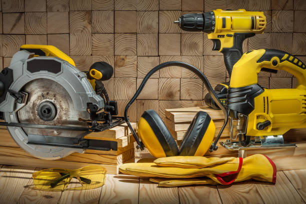 istock construction carpentry tools electric corded circular saw jigsaw cordless drill earphones gloves goggles on wooden background 1263342022