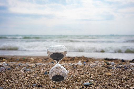 Time is up. Hourglass at sea.