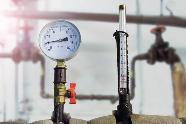 istock Mixers, thermometer and pressure sensor on old water pipes. 1263350483