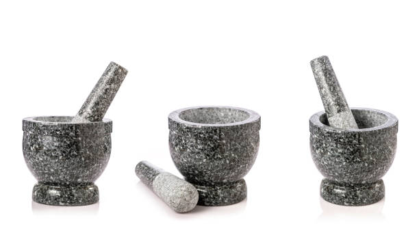 istock New natural stone mortar and pestle isolated on white 1263350608