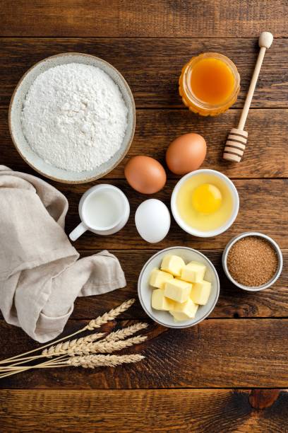 istock Ingredients for baking on a wooden table background 1263353196