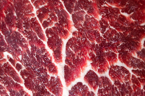 Abstract pattern of white fat on red beef