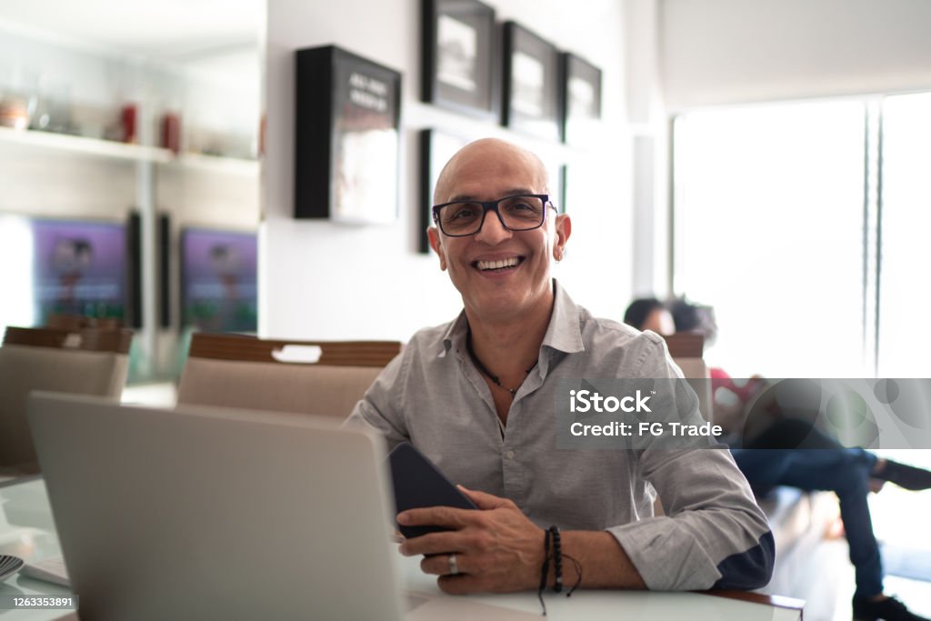 Portrait of a mature man working from home Men Stock Photo