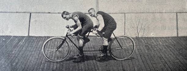 istock Tandem cyclists in a velodrome, side view, wooden floor 1263355055