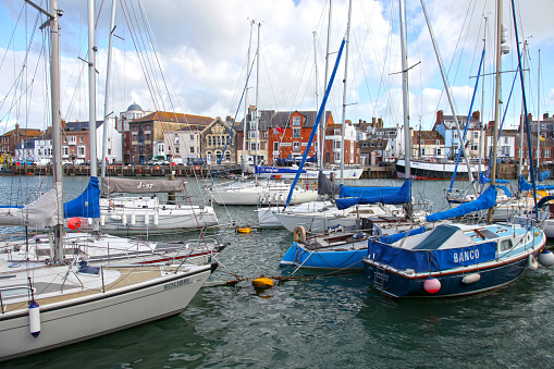 Weymouth, Dorset, UK - June 6, 2017 - Yachts and boats at Weymouth Harbor and the River Wey in the county of Dorset.