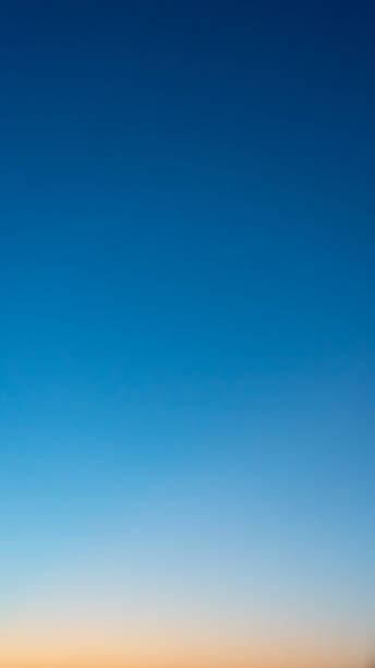 istock Colorful clear sky with no clouds at dusk after sunset 1263357269