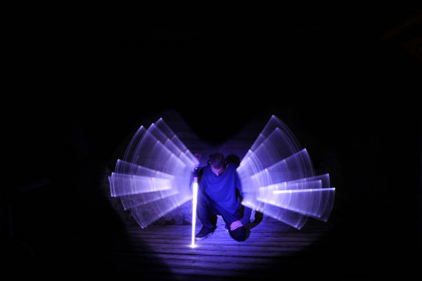 istock Man on his knees with a light sword. 1263359879