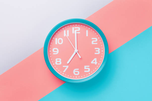 istock Alarm clock with a round dial on a colored background in the style of material design 1263360041