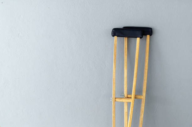 istock closeup pair wooden crutches on gray background 1263363493