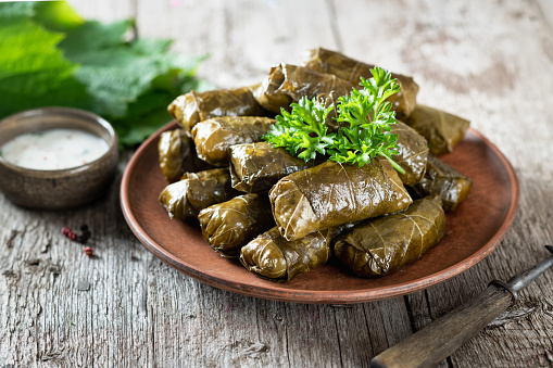 Dolma - stuffed grape leaves with rice and meat. Traditional Greek, Caucasian and Turkish cuisine