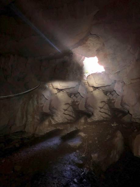 istock entry to a cave in the rock 1263366139