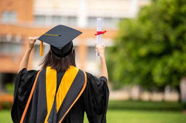 istock Graduation congratulations,The graduates stand in-line while waiting for awarding degree certificate. 1263374472