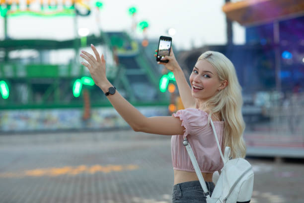 istock Young woman at the amusement park 1263379774